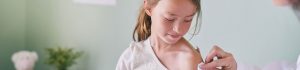 A little girl being immunized